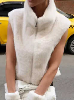 Manteau sans manches en fausse fourrure bicolore crème et blanc cassé fermeture éclair intégrale col montant gilet chaud