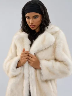 Manteaux en fausse fourrure blanche à revers crantés Veste longue d'hiver surdimensionnée pour femmes 2026