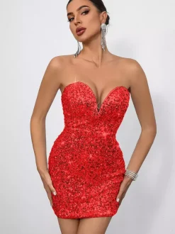 Mini-robe moulante à sequins décolleté en c艙ur et n艙ud dans le dos idéale pour les fêtes 2026