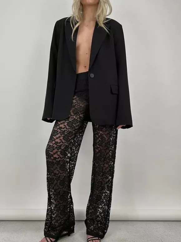 Pantalon en dentelle blanche taille naturelle coupe droite