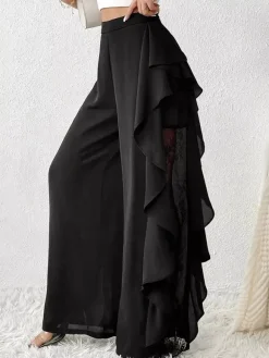 Pantalon noir uni à volants et taille naturelle idéal pour l'été