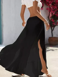 Pantalon palazzo fluide à taille haute élastique et fentes latérales pour femme idéal comme paréo de plage.