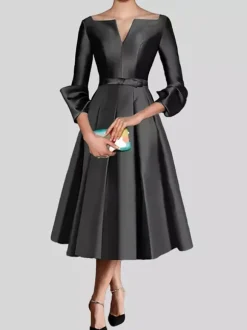 Petite robe noire jolie col en V manches 3/4 n艙uds tissu satiné ligne trapèze