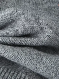 Pull asymétrique à taille côtelée et manches lanternes pour femme (2026)