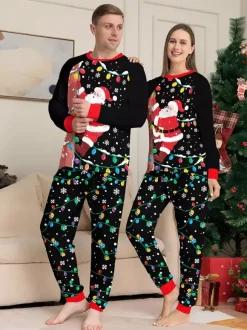 Pyjamas de Noël familiaux imprimés Père Noël noir et rouge et guirlandes lumineuses collection 2026