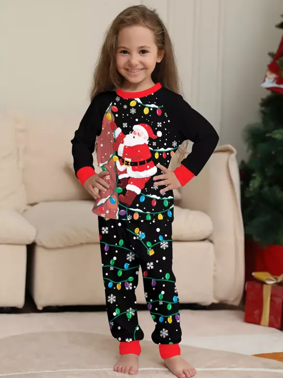 Pyjamas de Noël familiaux imprimés Père Noël noir et rouge et guirlandes lumineuses collection 2026