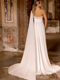 Robe de mariée bohème en mousseline de soie et dentelle deux pièces avec traîne taille naturelle fermeture éclair sans manches décolleté design ivoire