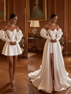 Robe de mariée deux pièces en satin décolleté travaillé coupe trapèze avec traîne fermeture éclair manches 3/4 longues
