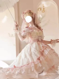 Robe de mariée Lolita rose style ballet ornée de n艙uds et de volants avec traîne.