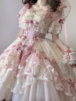 Robe de mariée Lolita rose style ballet ornée de n艙uds et de volants avec traîne.