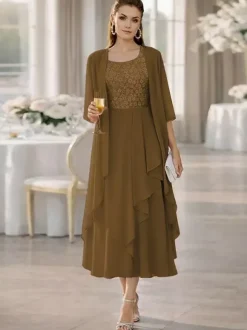 Robe de mère de la mariée deux pièces col rond manches mi-longues coupe trapèze dentelle longueur thé idéale pour un mariage ou une réception.
