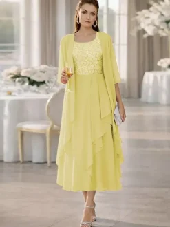 Robe de mère de la mariée deux pièces col rond manches mi-longues coupe trapèze dentelle longueur thé idéale pour un mariage ou une réception.