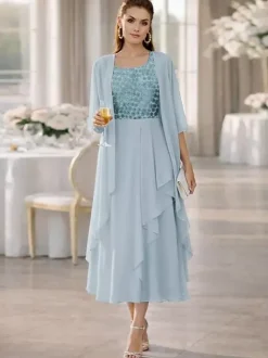 Robe de mère de la mariée deux pièces col rond manches mi-longues coupe trapèze dentelle longueur thé idéale pour un mariage ou une réception.