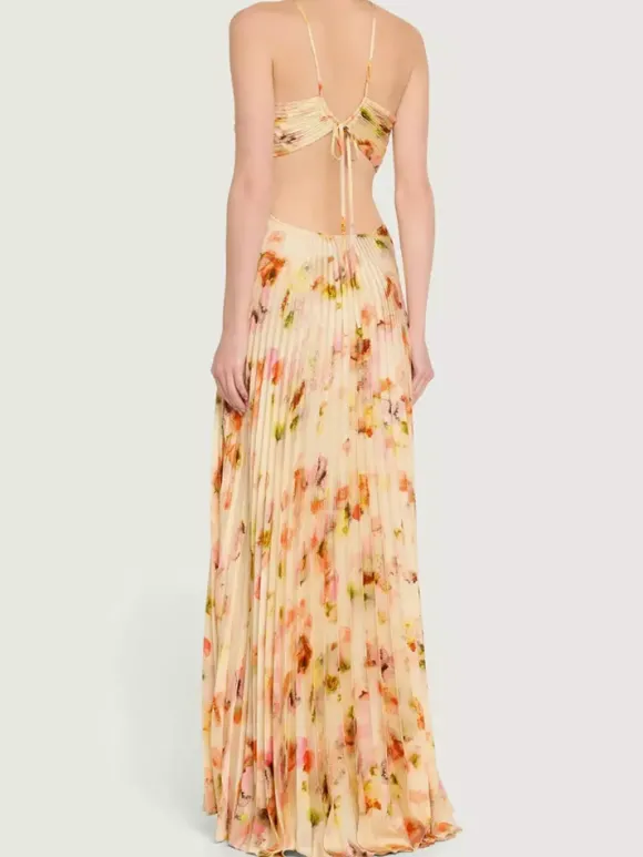 Robe de soirée longue à bretelles spaghetti et dos nu imprimé floral style bohème idéale pour l'été et la plage.
