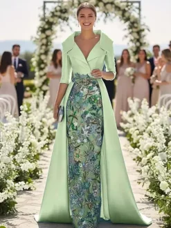 Robe de soirée pour la mère de la mariée col en V manches 3/4 coupe trapèze en dentelle idéale pour un mariage.