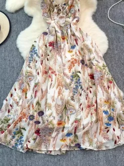 Robe de vacances maxi dos nu à fleurs bretelles fines sans manches imprimé floral col chic couleur abricot
