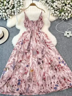 Robe de vacances maxi dos nu à fleurs bretelles fines sans manches imprimé floral col chic couleur abricot