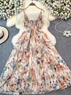 Robe de vacances maxi dos nu à fleurs bretelles fines sans manches imprimé floral col chic couleur abricot