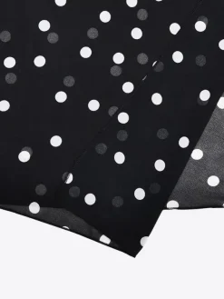 Robe de vacances maxi sans manches à pois col en V robe noire sexy