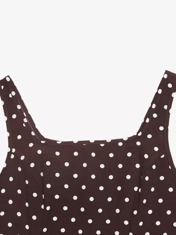 Robe d'été longue à pois marron bretelles spaghetti coupe fluide style évasé.