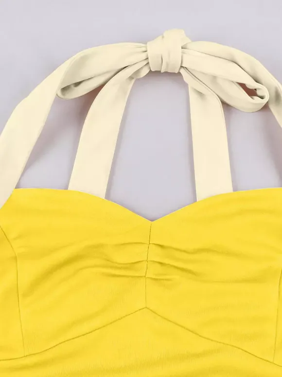 Robe jaune dos nu vintage swing avec ceinture blanche contrastante style rockabilly rétro années 50