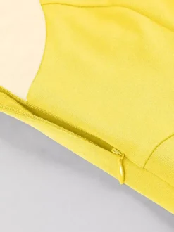 Robe jaune dos nu vintage swing avec ceinture blanche contrastante style rockabilly rétro années 50