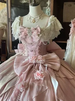 Robe Lolita féerique rose robe de bal ornée de perles et de fleurs n艙ud dans le dos bandage en dentelle manches en dentelle.