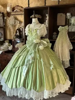 Robe Lolita féerique rose robe de bal ornée de perles et de fleurs n艙ud dans le dos bandage en dentelle manches en dentelle.