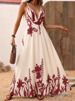 Robe longue fluide à bretelles spaghetti imprimé floral crème bordeaux décolleté en V profond idéale pour l'été et la plage.