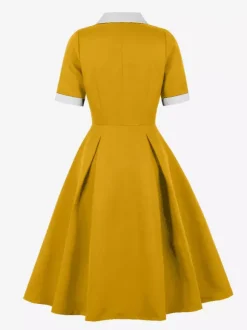 Robe midi élégante à revers rétro et boutons latéraux coupe ajustée et évasée pour femme (collection 2026)