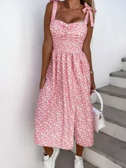 Robe midi rose en lycra spandex pour femme dos nu sans manches à fleurs et taille naturelle ornée de fleurs.