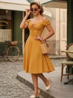 Robe mi-longue vintage à pois manches bouffantes et lien sur le devant (2026)
