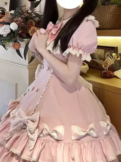 Robe Sweet Lolita rose à manches courtes volants et n艙uds avec chapeau.