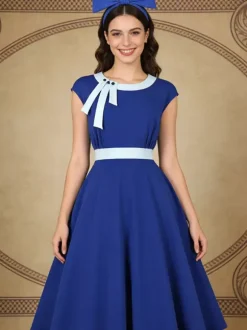Robe swing vintage pour femme années 1950 ornée de détails contrastés col à n艙ud idéale pour un tea party.