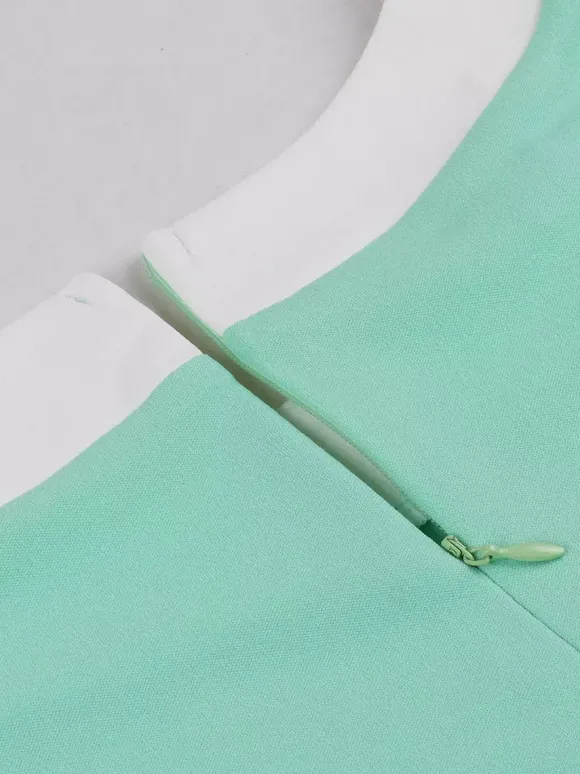 Robe swing vintage pour femme années 1950 ornée de détails contrastés col à n艙ud idéale pour un tea party.