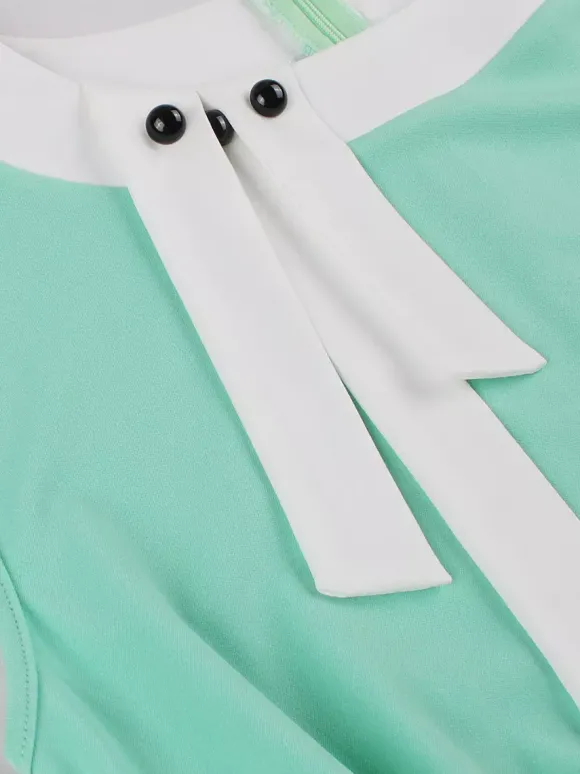 Robe swing vintage pour femme années 1950 ornée de détails contrastés col à n艙ud idéale pour un tea party.