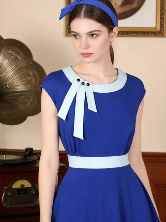 Robe swing vintage pour femme années 1950 ornée de détails contrastés col à n艙ud idéale pour un tea party.