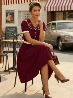 Robe trapèze à manches bouffantes col Peter Pan et broderies double épaisseur collection femme 2026