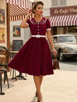 Robe trapèze à manches bouffantes col Peter Pan et broderies double épaisseur collection femme 2026