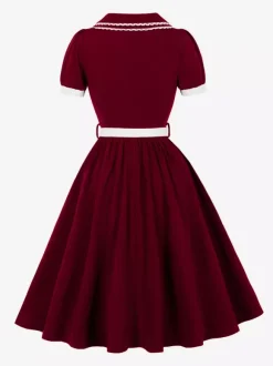 Robe trapèze à manches bouffantes col Peter Pan et broderies double épaisseur collection femme 2026