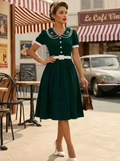 Robe trapèze à manches bouffantes col Peter Pan et broderies double épaisseur collection femme 2026