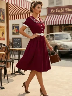 Robe trapèze à manches bouffantes col Peter Pan et broderies double épaisseur collection femme 2026