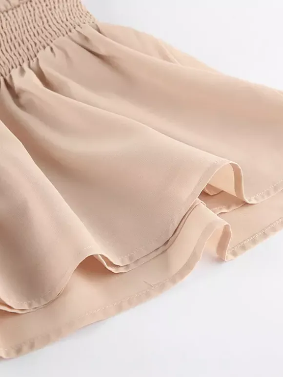 Robe courte kaki sans manches dos nu col montant taille naturelle