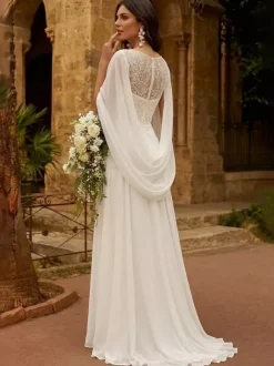 Robe de mariée avec châle coupe trapèze manches mi-longues dentelle col bijou