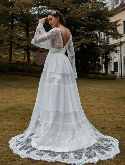 Robe de mariée bohème col V manche longue dos nu à traîne