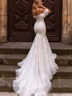 Robe de mariée sirène en dentelle décolleté en c艙ur taille naturelle avec traîne