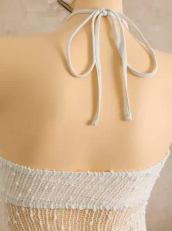 Robe de plage midi dos nu à boutons soleil en maille ajourée transparente