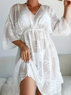 Robe de vacances chic noire à manches 3/4 et col en V transparente et sculptante