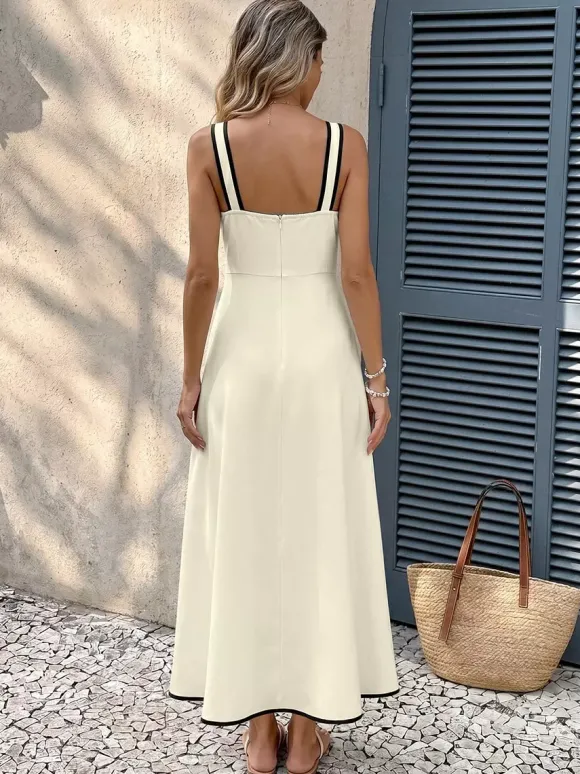Robe de vacances ivoire à bretelles midi et bordures noires contrastées