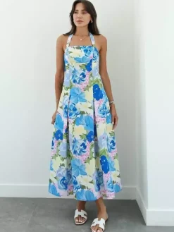 Robe de vacances sculptante dos nu en dentelle sans manches à bretelles imprimées rose élégante